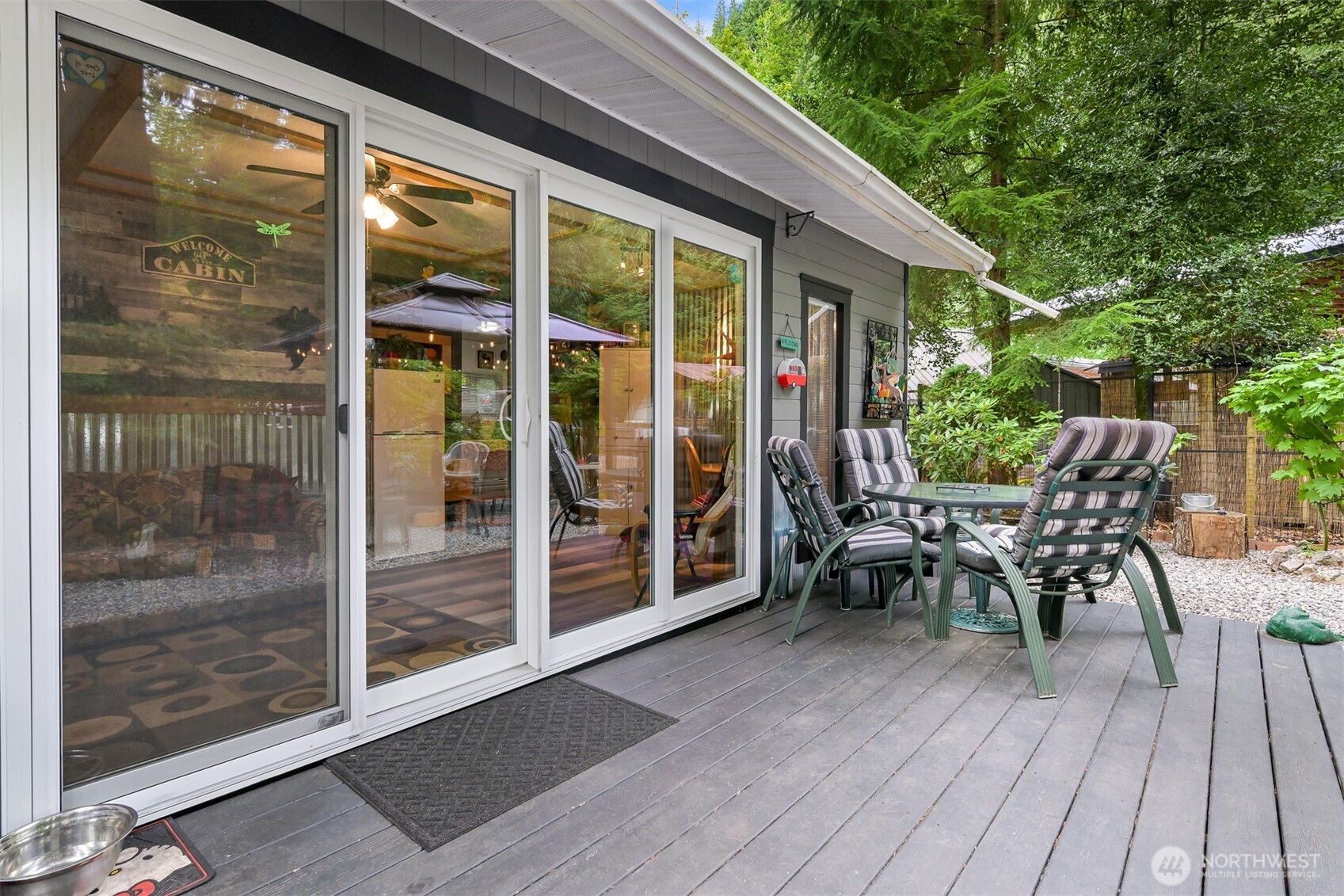1010 Maple Lane Maple Falls, WA 98266 - Photo 16 of 40 a view of a patio with a table and chairs next to a yard