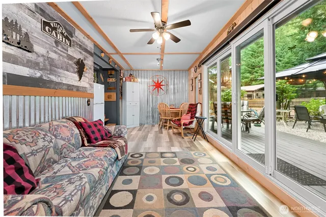 a living room with furniture and a rug