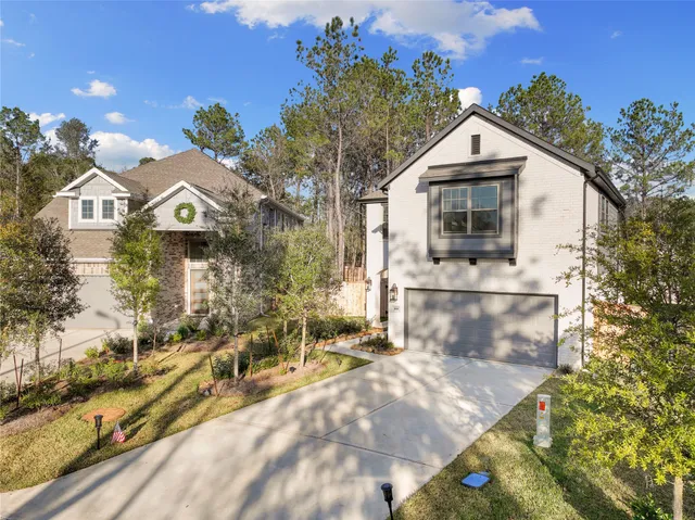 a view of multiple houses with a yard