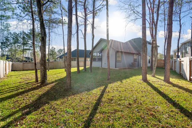 a view of a house with a backyard