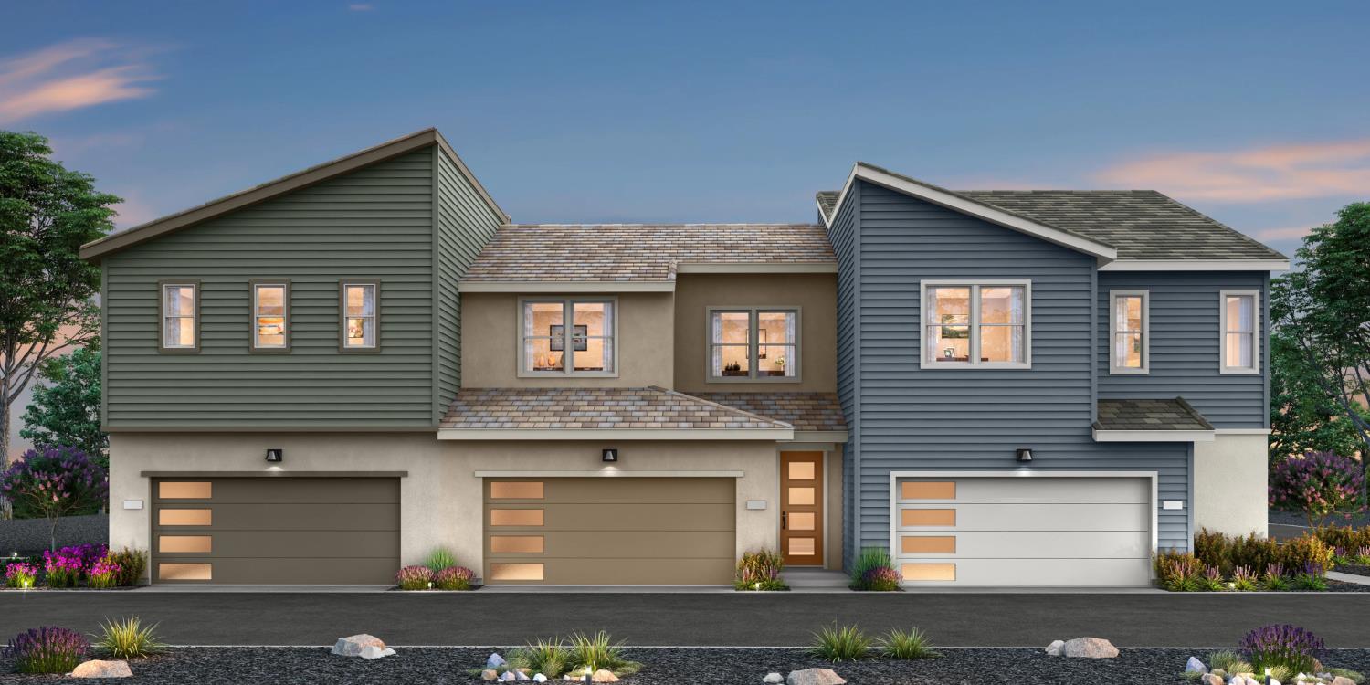 a front view of a house with garage