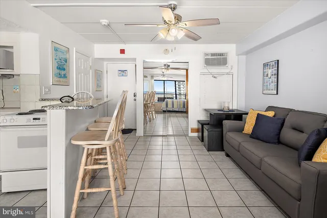 a kitchen with cabinets and chairs