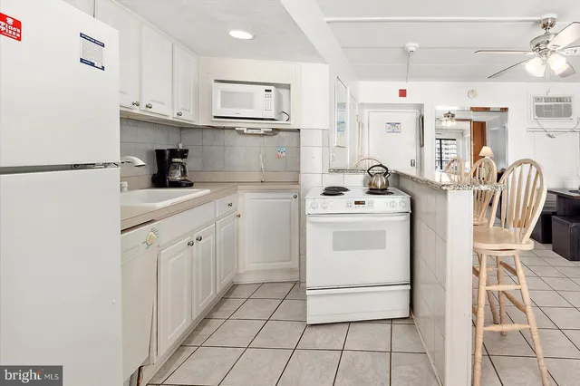 a view of a workspace with furniture and a couch