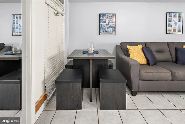 a bedroom with a bed and a lamp