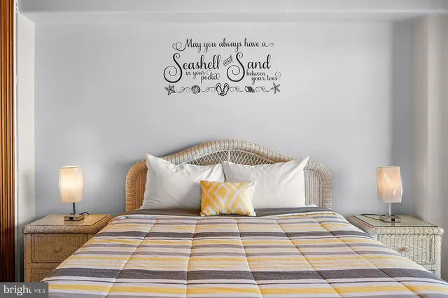 a spacious bedroom with a bed and a flat screen tv