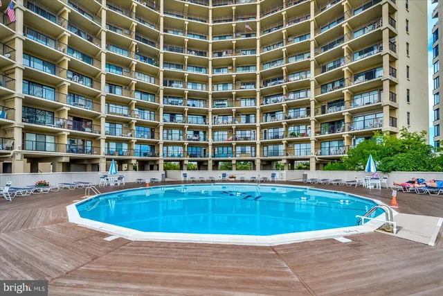 a view of a swimming pool with a balcony