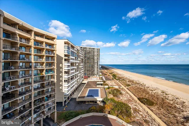a view of a swimming pool with an outdoor seating