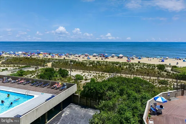 a view of a house with a flower garden