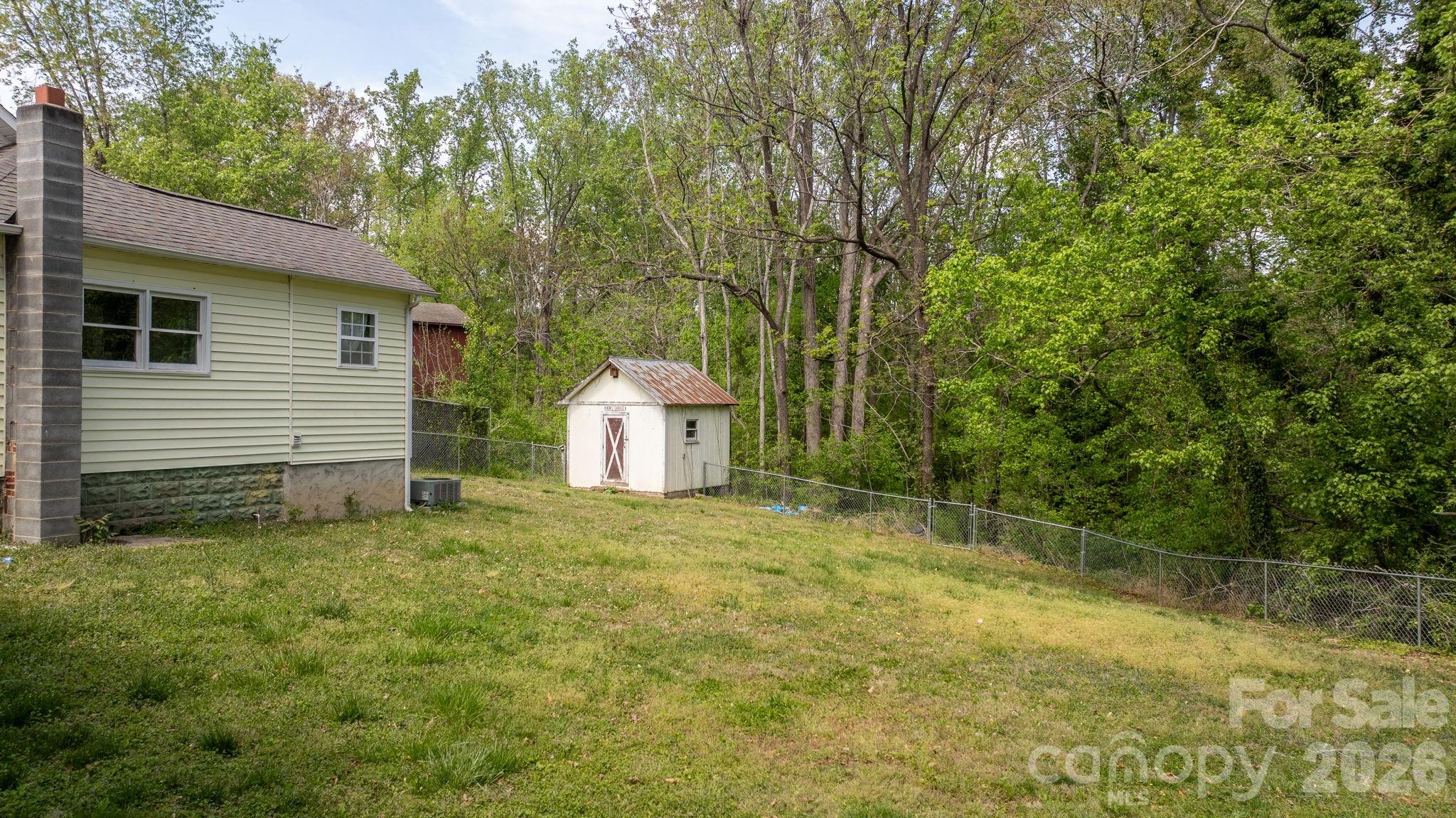715 Main Street Hudson, NC 28638 - Photo 20 of 26 a bathroom with a sink and a yard