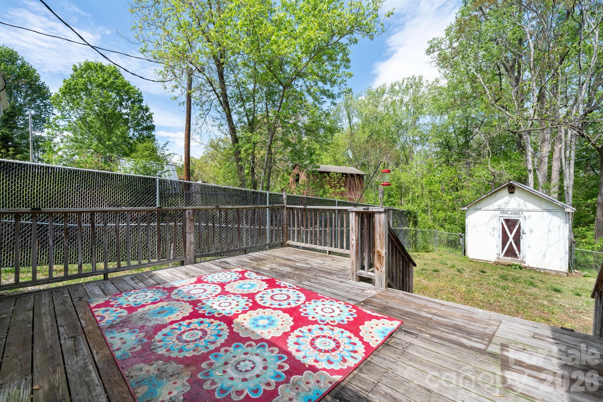 715 Main Street Hudson, NC 28638 - Photo 21 of 26 a balcony with wooden floor and lake view