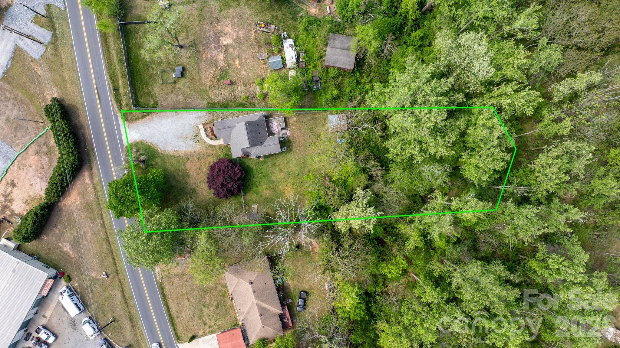715 Main Street Hudson, NC 28638 - Photo 23 of 26 an aerial view of residential house with outdoor space and trees all around