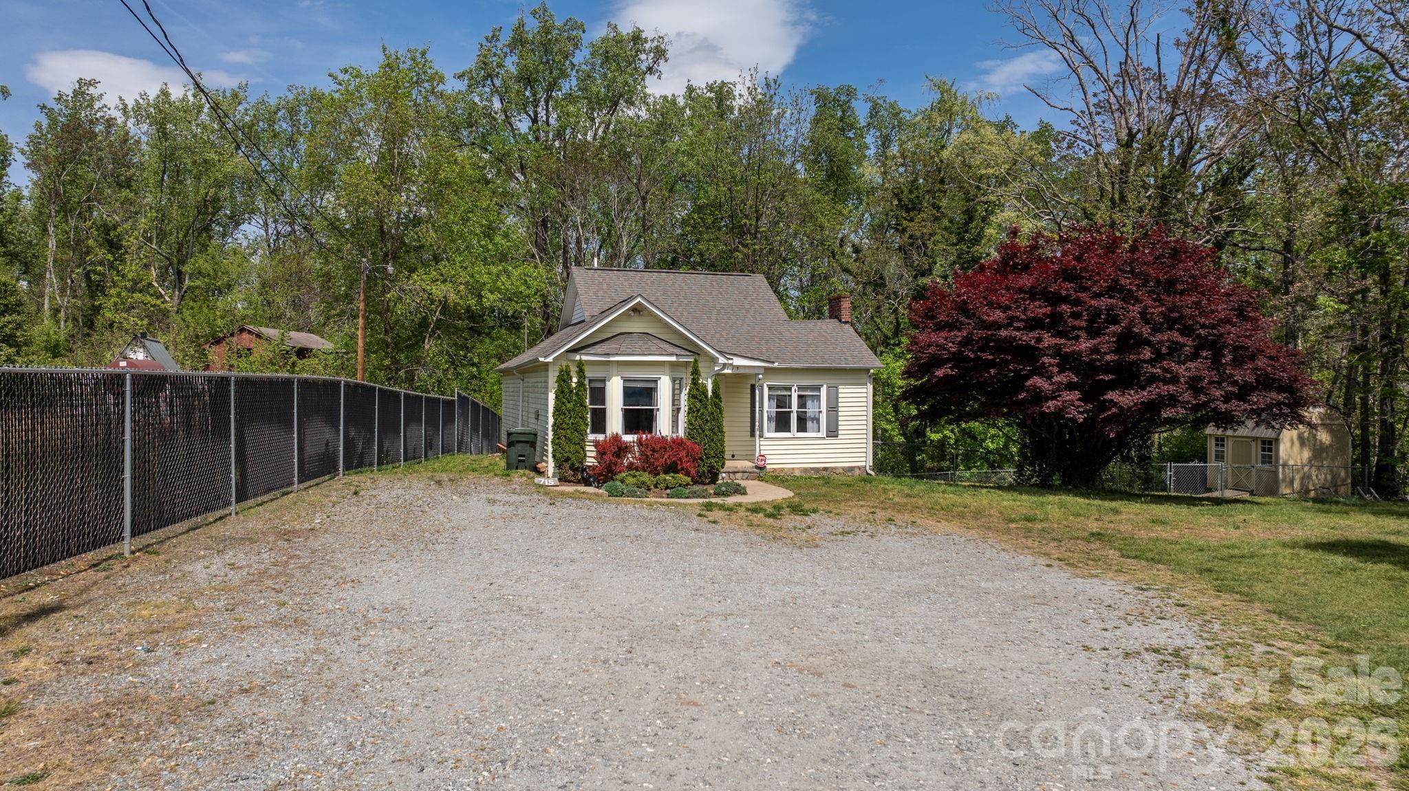 715 Main Street Hudson, NC 28638 - Photo 25 of 26 a view of house with outdoor space and trees in the background
