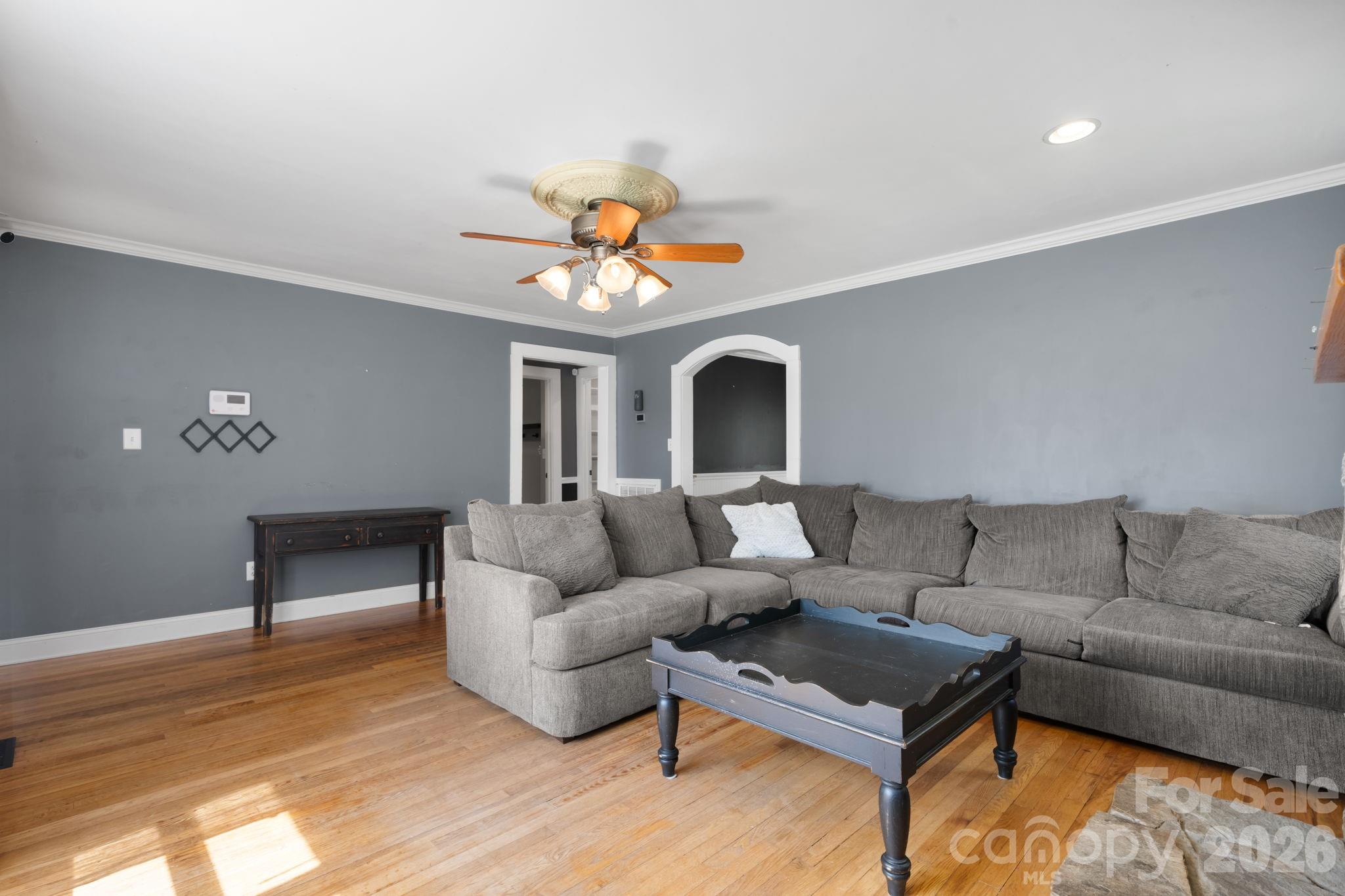 715 Main Street Hudson, NC 28638 - Photo 5 of 26 a living room with furniture and a wooden floor