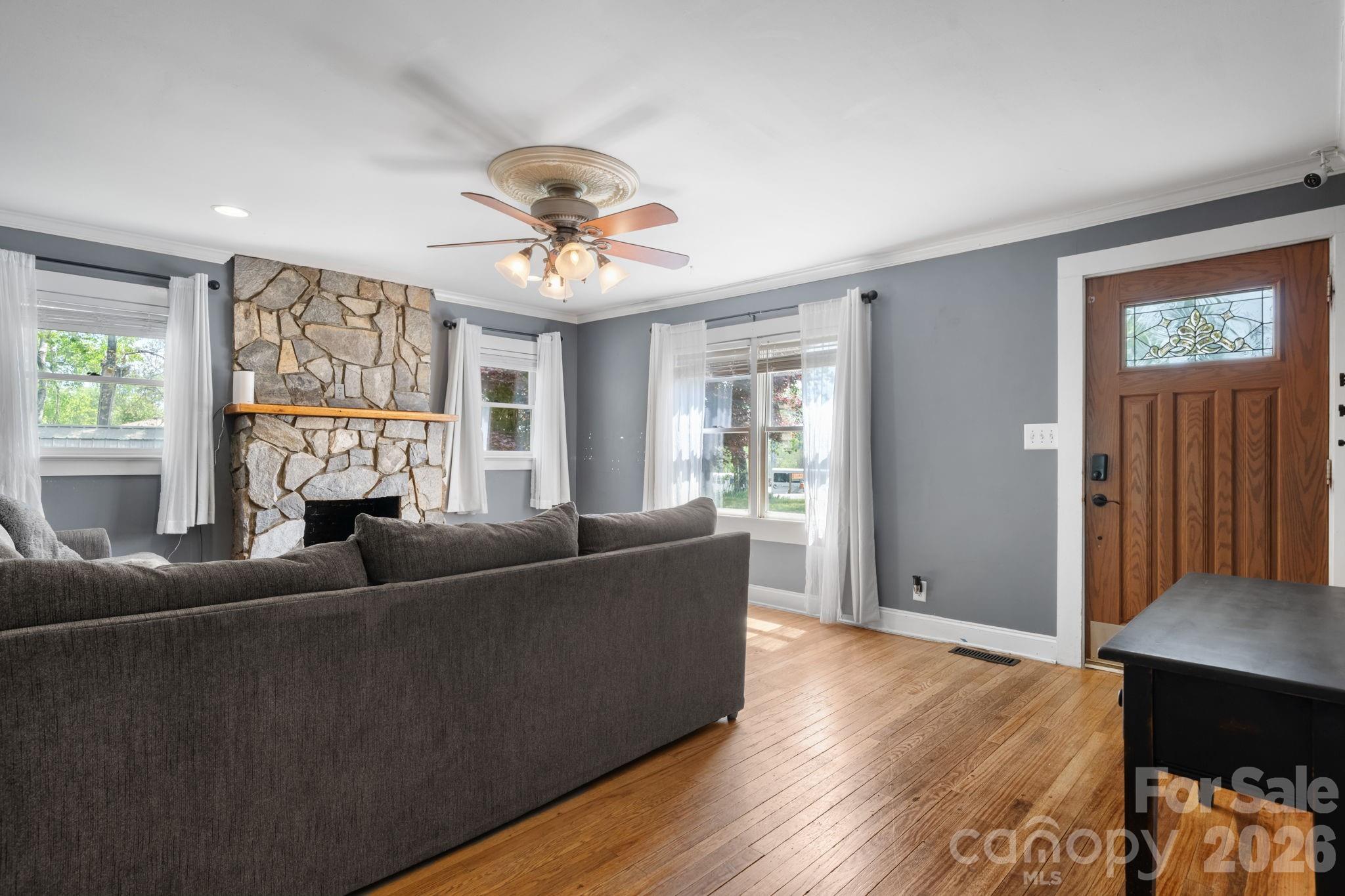715 Main Street Hudson, NC 28638 - Photo 7 of 26 a living room with furniture and a window