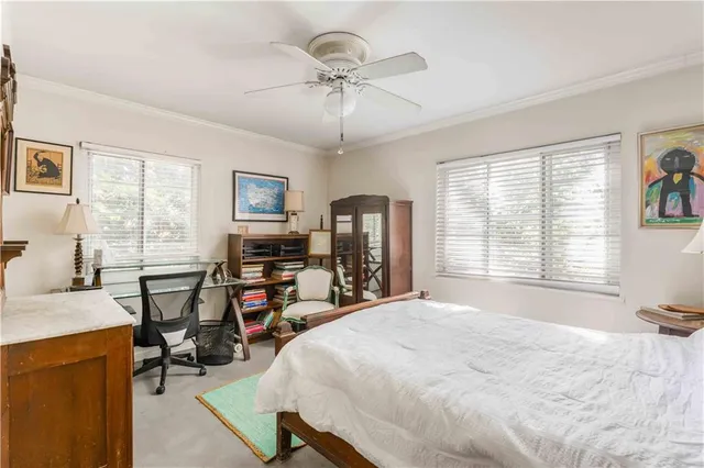 a bedroom with bed and chair