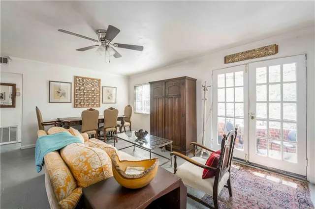 a dining room with furniture and a window