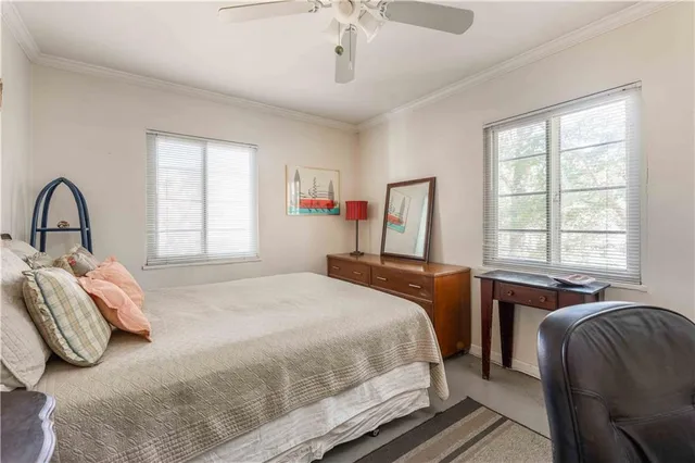 a bed room with a bed and a desk