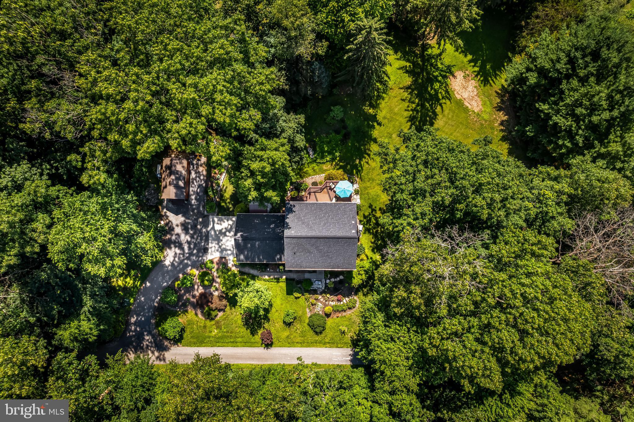 5026 Mt Carmel Road Hampstead, MD 21074 - Photo 51 of 57 an aerial view of a house with a yard and large trees