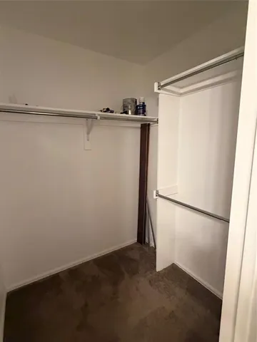a view of an empty walk in closet