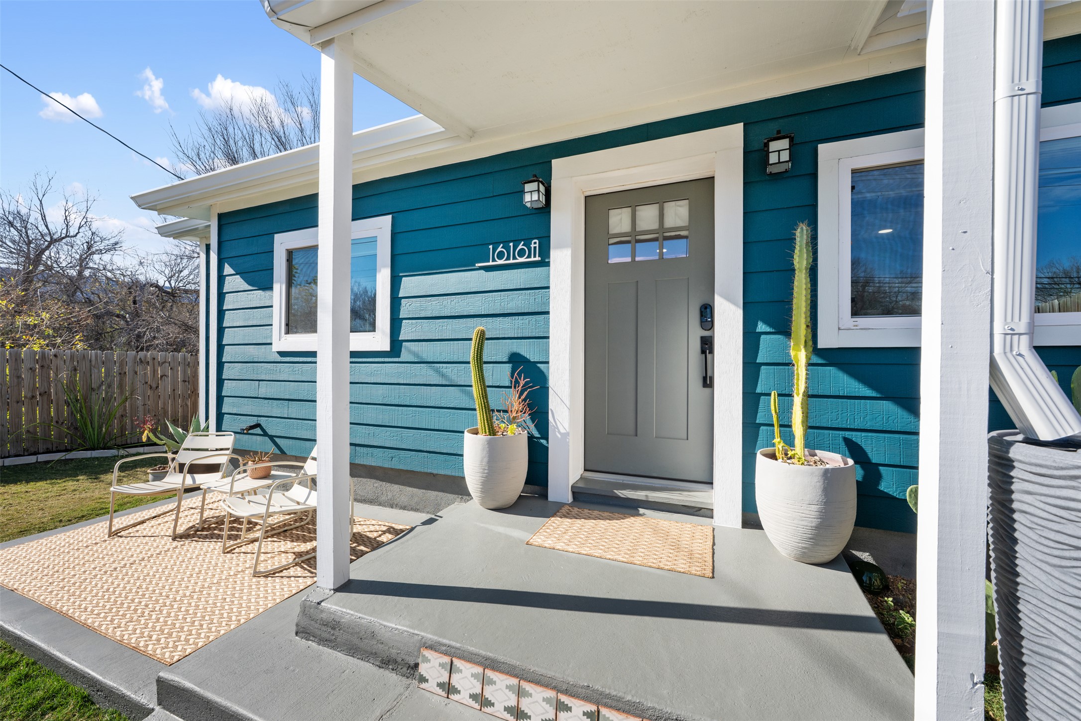 1616 Webberville Road, Unit A Austin, TX 78721 - Photo 1 of 27 a view of a chair and tables front of house