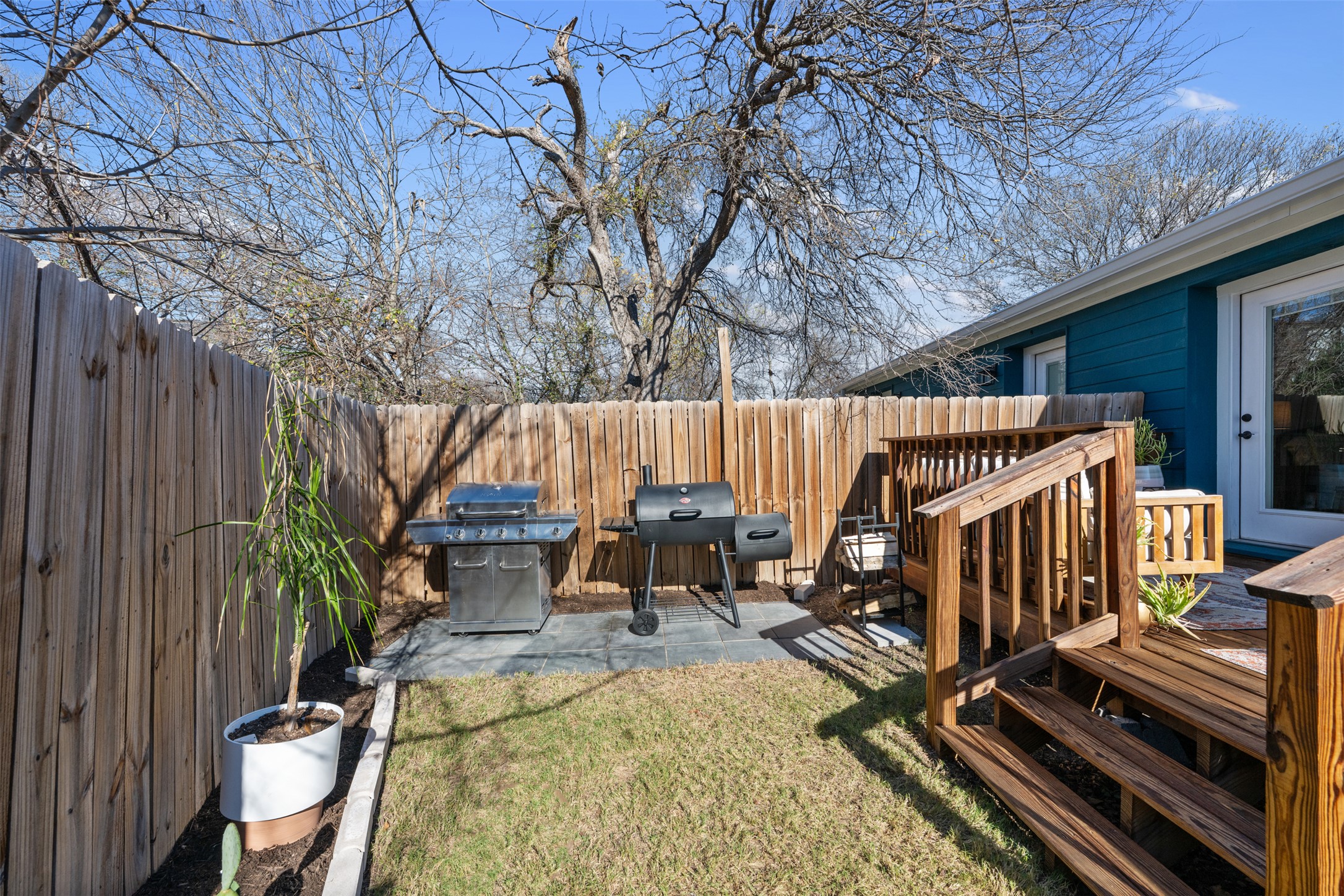 1616 Webberville Road, Unit A Austin, TX 78721 - Photo 21 of 27 a view of a patio with two chairs and a table
