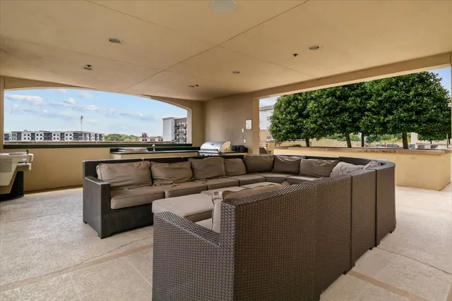 a living room with furniture a large window