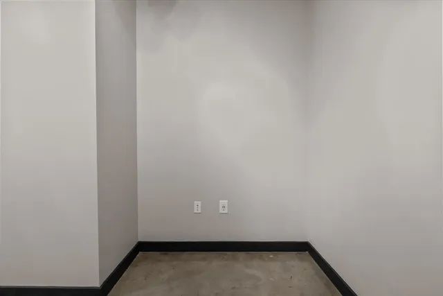 a view of dining room with furniture and chandelier fan