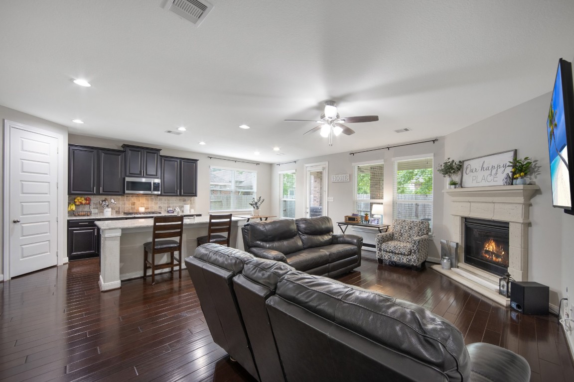 22622 Cutter Mill Drive Spring, TX 77389 - Photo 11 of 40 LIVING ROOM – OPEN CONCEPT VIEW
Seamless flow from the living room into the kitchen highlights the open-concept design ideal for gatherings and everyday living.