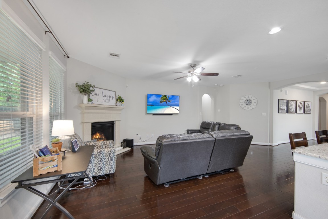 22622 Cutter Mill Drive Spring, TX 77389 - Photo 12 of 40 LIVING ROOM – FIREPLACE FOCAL POINT
Inviting fireplace anchors the room, adding warmth and charm to this comfortable living space.