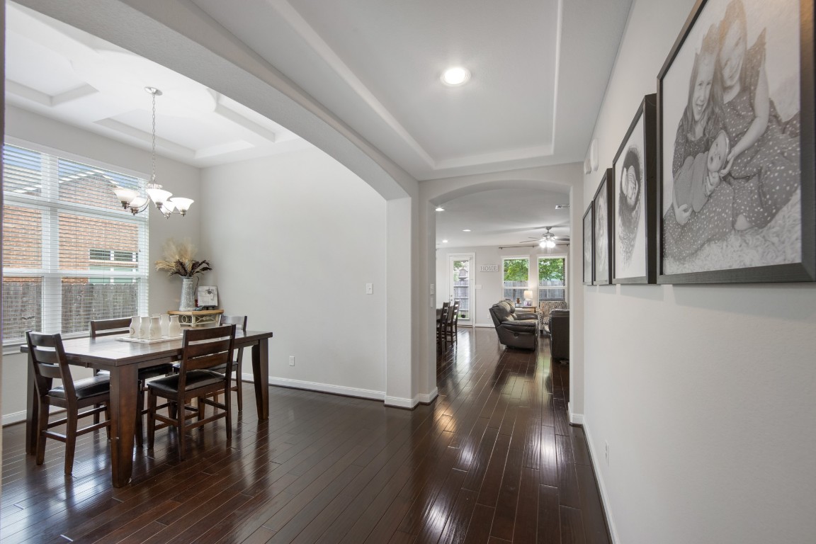 22622 Cutter Mill Drive Spring, TX 77389 - Photo 20 of 40 DINING ROOM – Framed by elegant archways and a stunning tray ceiling, this space sets the stage for everything from quiet dinners to unforgettable gatherings.