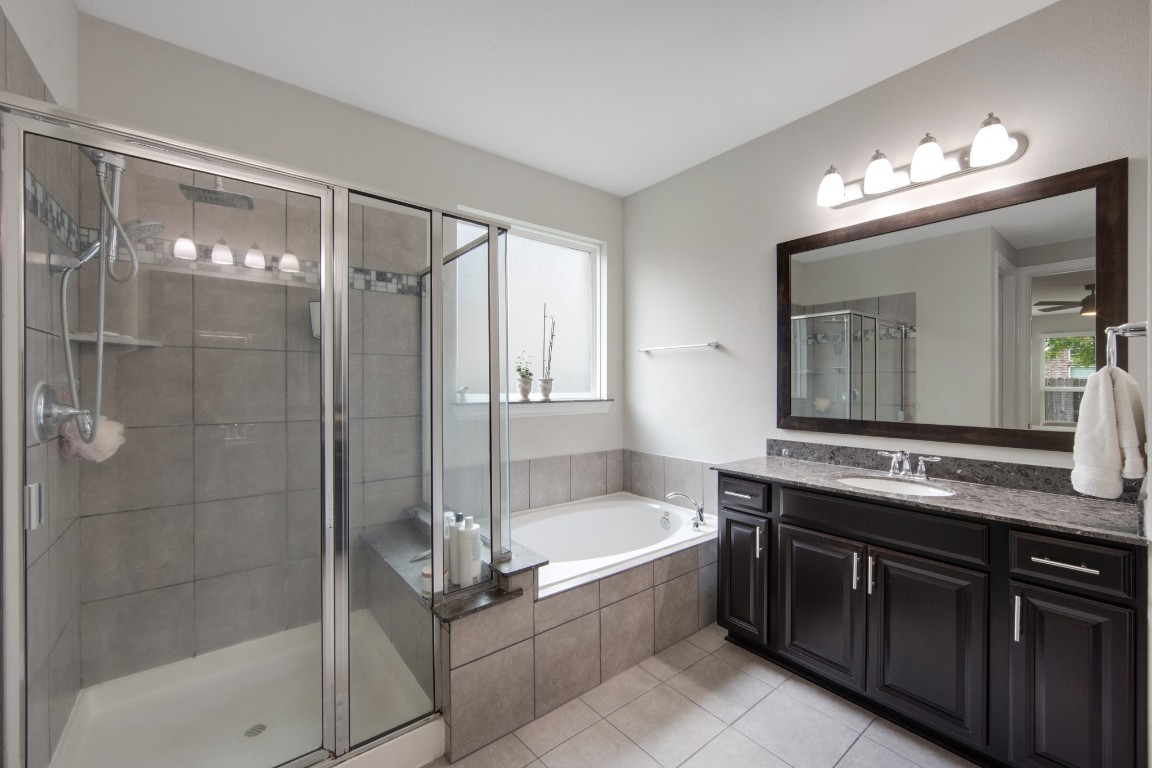 22622 Cutter Mill Drive Spring, TX 77389 - Photo 24 of 40 PRIMARY BATH – SHOWER & TUB
Separate glass-enclosed shower and soaking tub create a spa-like experience within the comfort of home.
