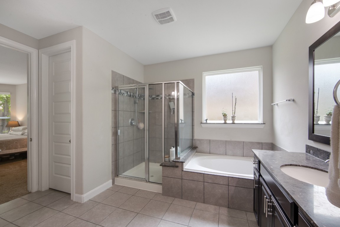 22622 Cutter Mill Drive Spring, TX 77389 - Photo 25 of 40 PRIMARY BATH – FULL VIEW
Spacious bathroom layout with natural light, oversized mirrors, and neutral finishes offers a clean and inviting feel.