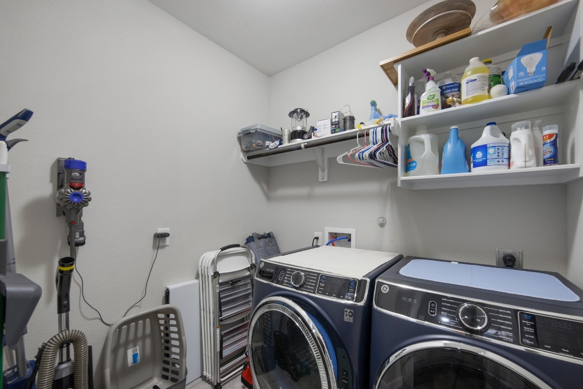 22622 Cutter Mill Drive Spring, TX 77389 - Photo 31 of 40 UTILITY ROOM
Dedicated utility room with built-in shelving provides practical storage and organization for everyday convenience.