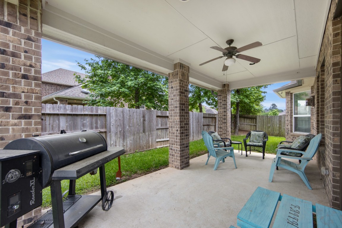 22622 Cutter Mill Drive Spring, TX 77389 - Photo 33 of 40 COVERED PATIO / BACKYARD
Covered patio with ceiling fan provides a comfortable outdoor retreat—perfect for relaxing or entertaining year-round.