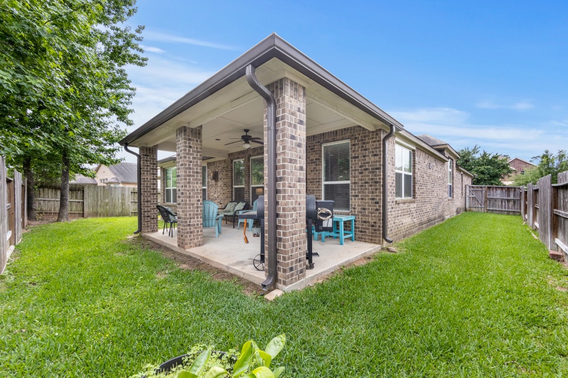 22622 Cutter Mill Drive Spring, TX 77389 - Photo 34 of 40 COVERED PATIO – Your outdoor living space awaits—morning coffee, evening conversations, and weekend grilling all happen here under this spacious covered patio.