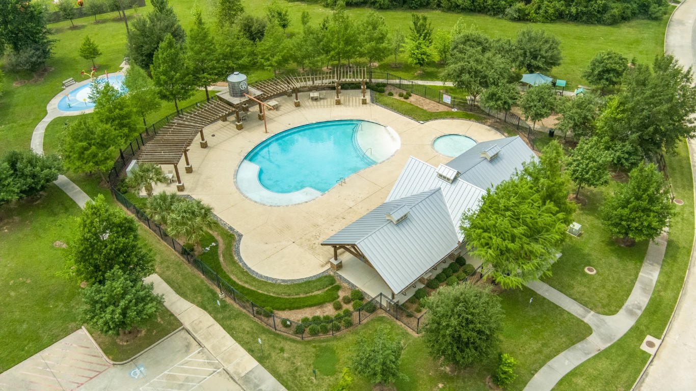 22622 Cutter Mill Drive Spring, TX 77389 - Photo 35 of 40 COMMUNITY POOL – Imagine weekends spent poolside, where resort-style living is just steps from your front door—cool off in the sparkling pool while kids enjoy the splash pad and neighbors gather under shaded pergolas.