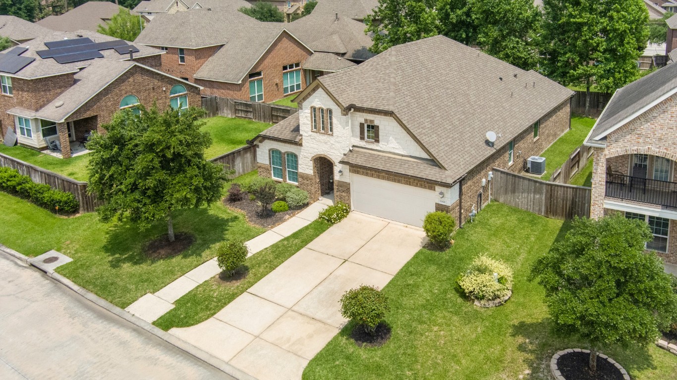 22622 Cutter Mill Drive Spring, TX 77389 - Photo 38 of 40 FRONT EXTERIOR – From the moment you arrive, the charming brick and stone elevation, manicured landscaping, and inviting entry set the tone for what’s inside.