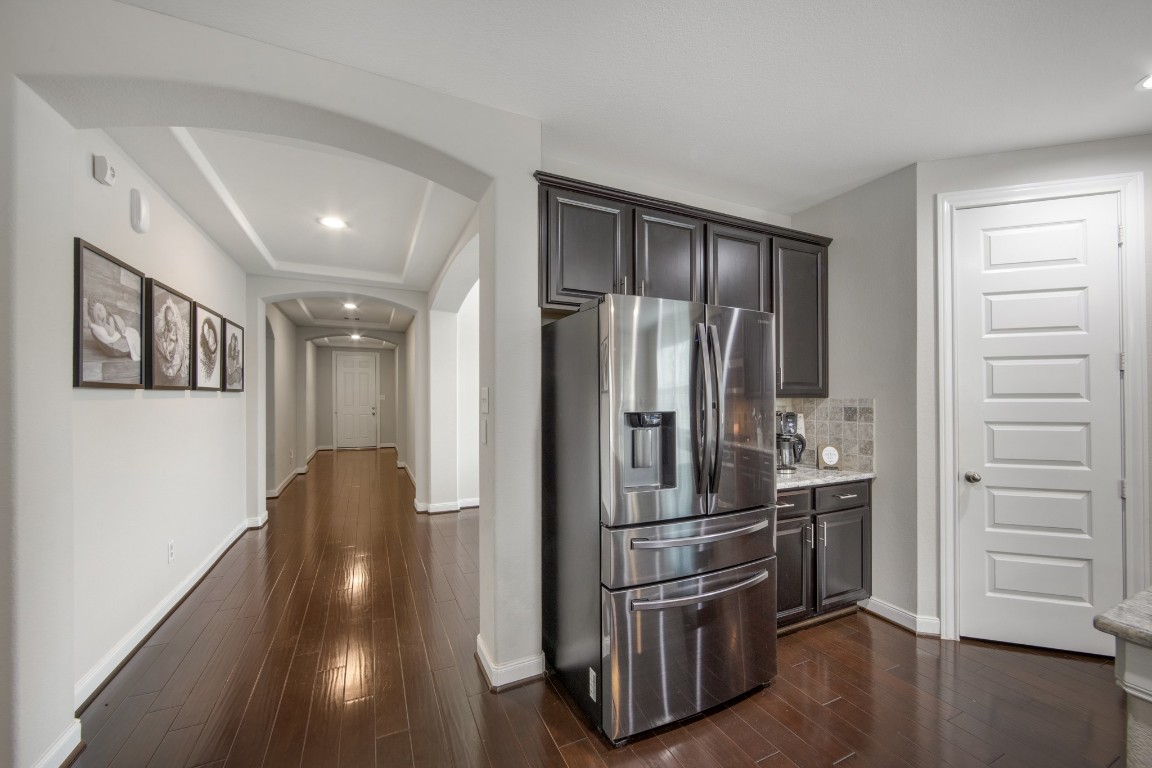 22622 Cutter Mill Drive Spring, TX 77389 - Photo 9 of 40 HALLWAY / TRANSITION SPACE – Wide, inviting, and thoughtfully designed, this corridor connects each space seamlessly while showcasing the home’s architectural detail and open feel.