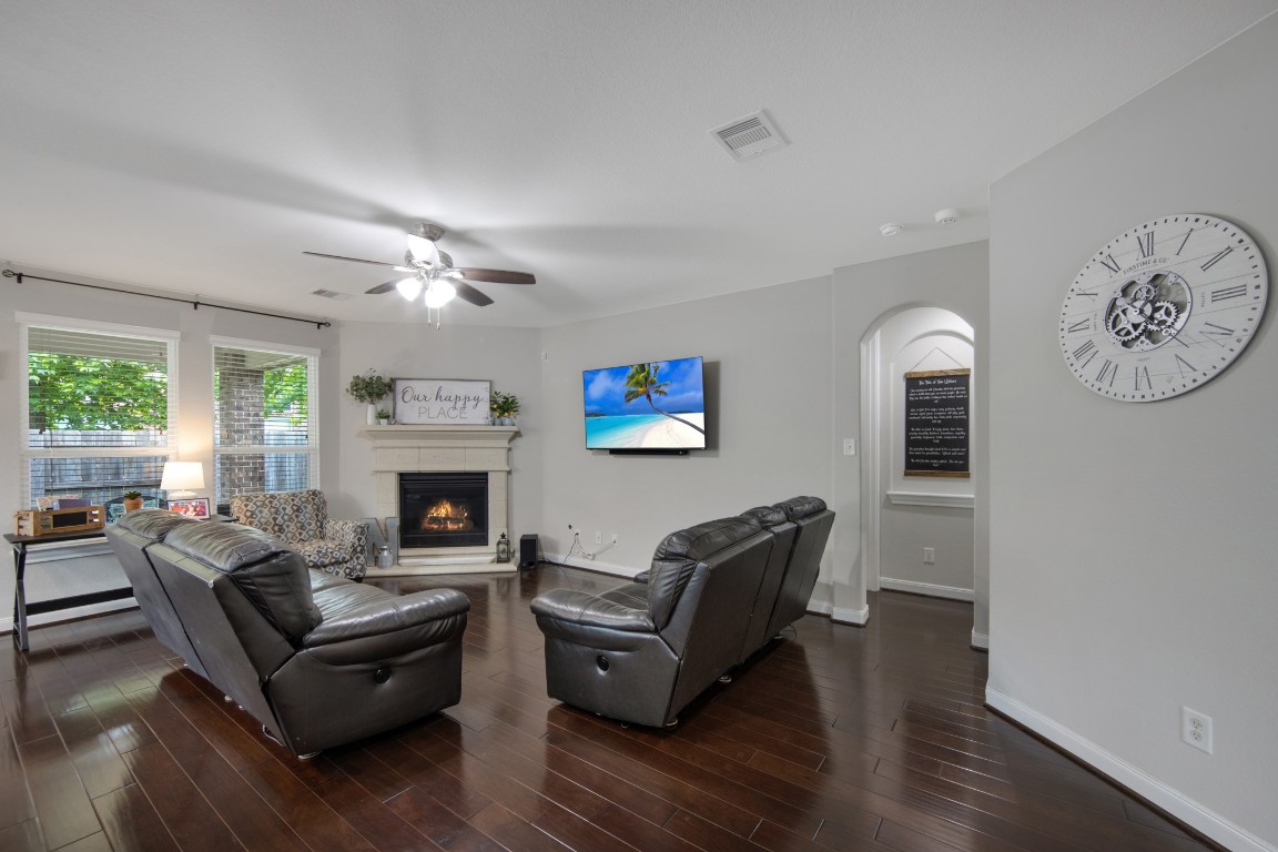 22622 Cutter Mill Drive Spring, TX 77389 - Photo 10 of 40 LIVING ROOM – MAIN VIEW
Spacious living area with rich wood flooring, abundant natural light, and a cozy fireplace creates the perfect space to relax or entertain.