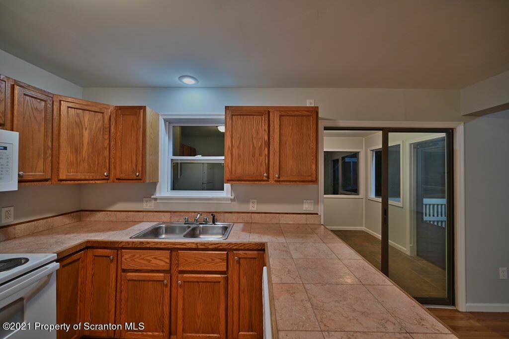 978 Goose Pond Road Lake Ariel, PA 18436 - Photo 18 of 44 a kitchen with a sink and cabinets