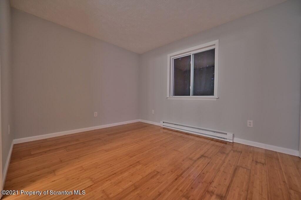 978 Goose Pond Road Lake Ariel, PA 18436 - Photo 21 of 44 wooden floor in an empty room