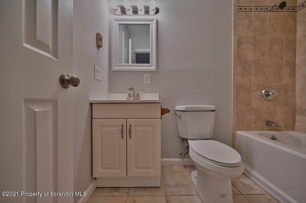 978 Goose Pond Road Lake Ariel, PA 18436 - Photo 23 of 44 a bathroom with a toilet sink vanity tub and shower