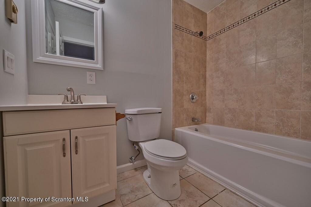 978 Goose Pond Road Lake Ariel, PA 18436 - Photo 24 of 44 a bathroom with a sink a toilet and shower