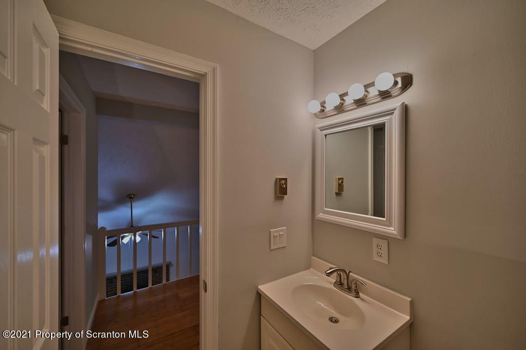 978 Goose Pond Road Lake Ariel, PA 18436 - Photo 26 of 44 a bathroom with a sink and a mirror