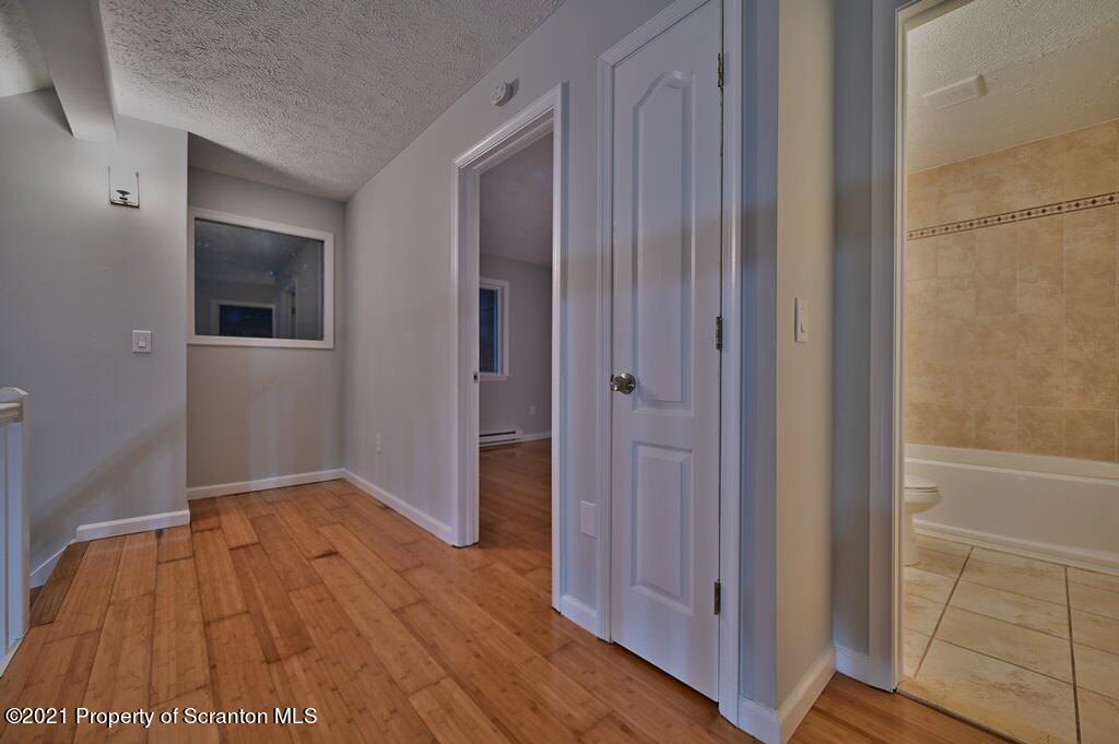 978 Goose Pond Road Lake Ariel, PA 18436 - Photo 27 of 44 a view of hallway with wooden floor