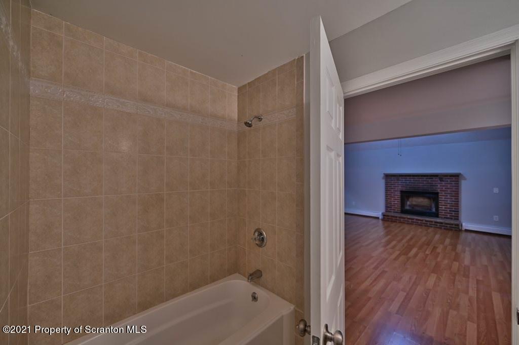 978 Goose Pond Road Lake Ariel, PA 18436 - Photo 43 of 44 a bathroom with a tub and a shower