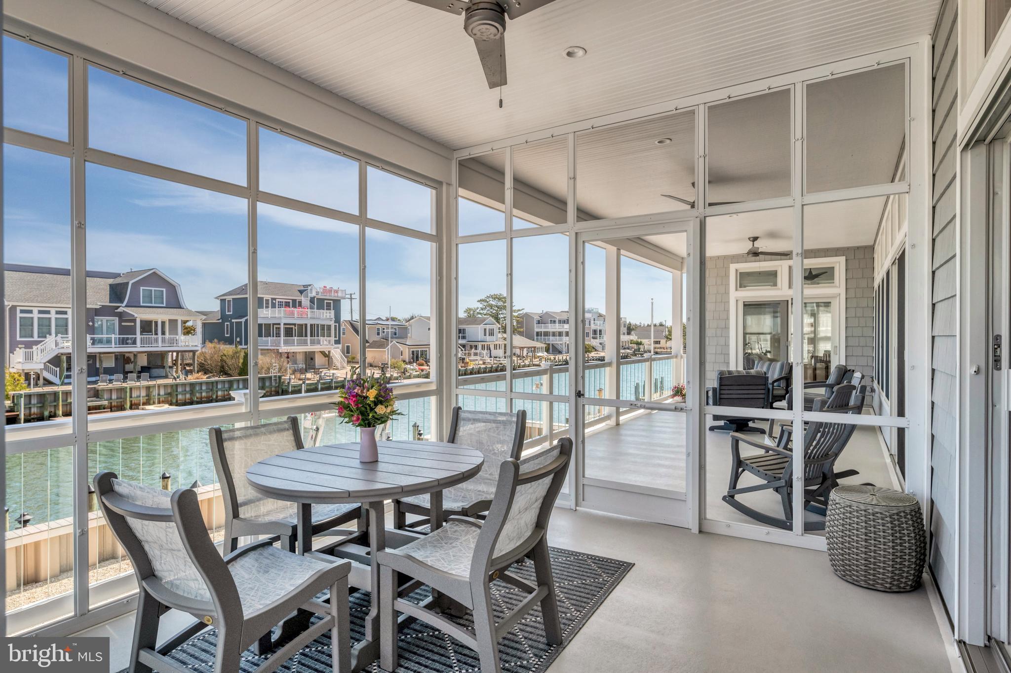 29 Amherst Road Long Beach Township, NJ 08006 - Photo 22 of 56 a dining room with furniture a chandelier and wooden floor