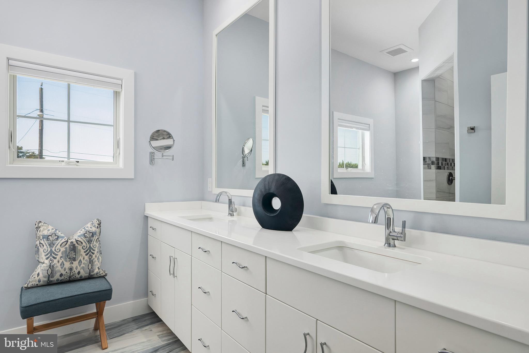 29 Amherst Road Long Beach Township, NJ 08006 - Photo 26 of 56 a bathroom with a sink and a mirror