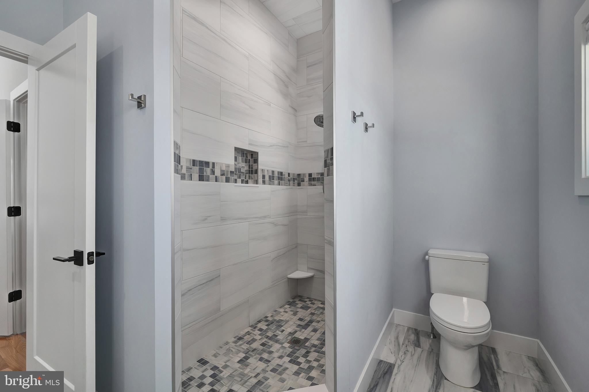 29 Amherst Road Long Beach Township, NJ 08006 - Photo 27 of 56 a bathroom with a toilet and shower