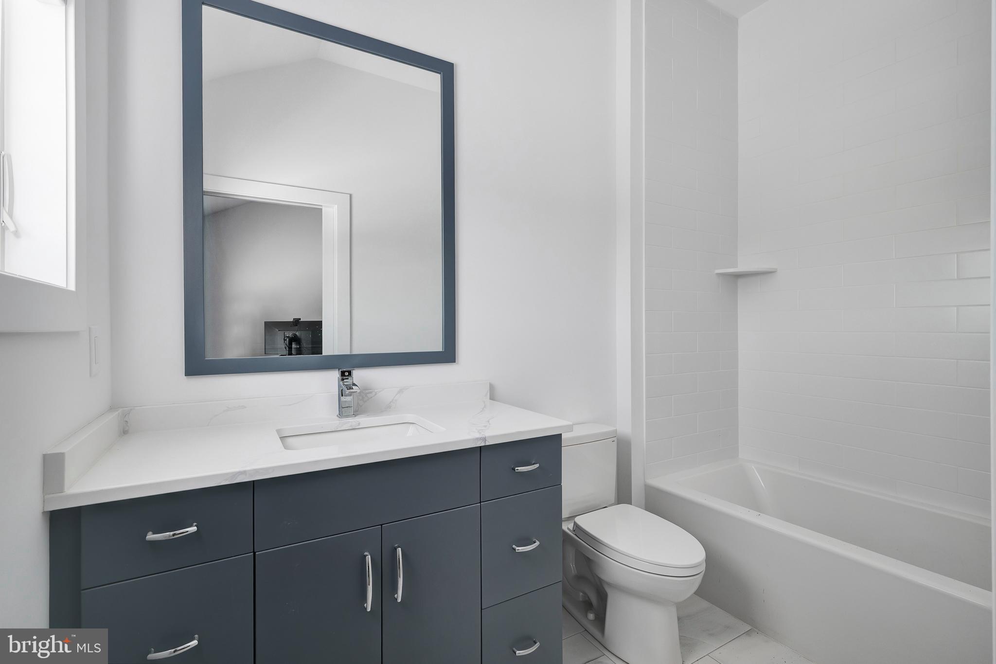 29 Amherst Road Long Beach Township, NJ 08006 - Photo 30 of 56 a bathroom with a sink toilet and shower